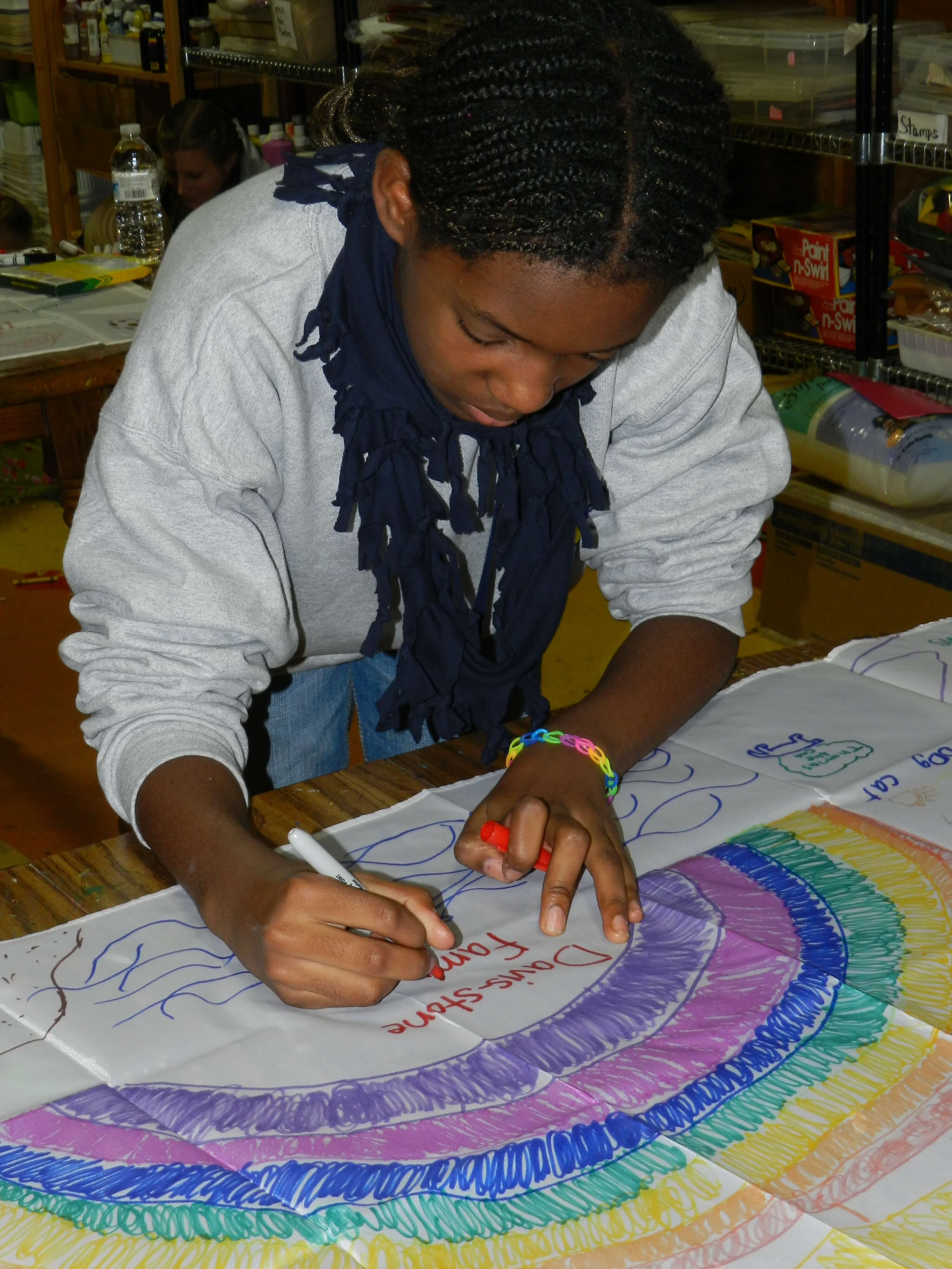 Children work on making family banners